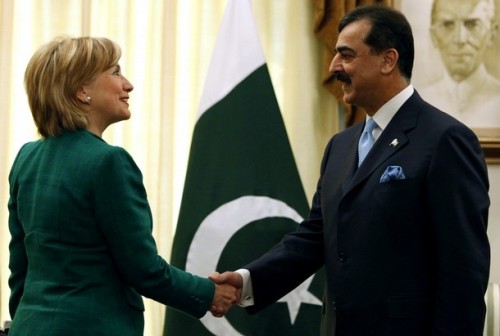 Pakistan's Prime Minister Gilani shakes hands with U.S. Secretary of State Clinton at his residence in Islamabad